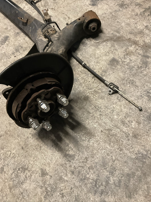 2014 TOYOTA PRIUS V REAR AXLE BEAM REAR SUSPENSION SUBFRAME ASSEMBLY OEM