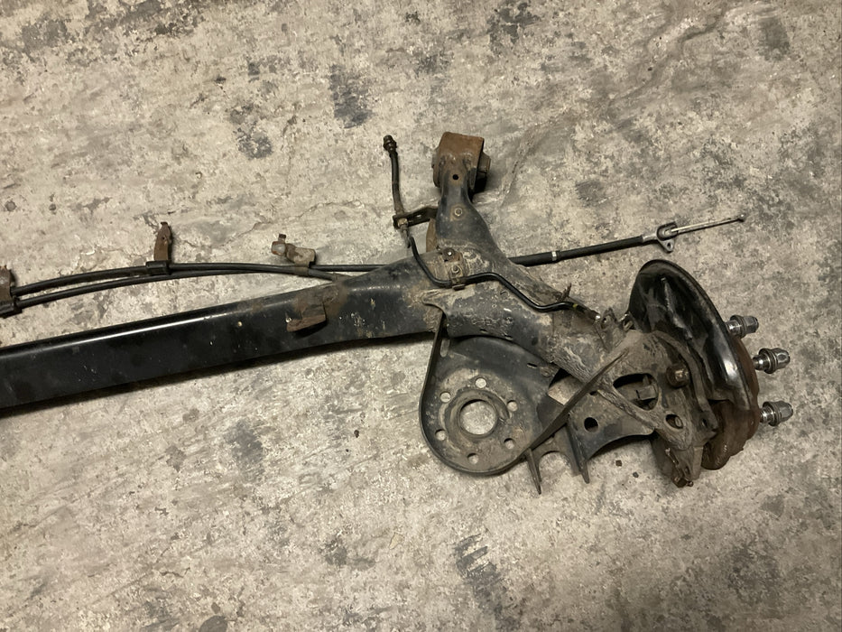 2014 TOYOTA PRIUS V REAR AXLE BEAM REAR SUSPENSION SUBFRAME ASSEMBLY OEM