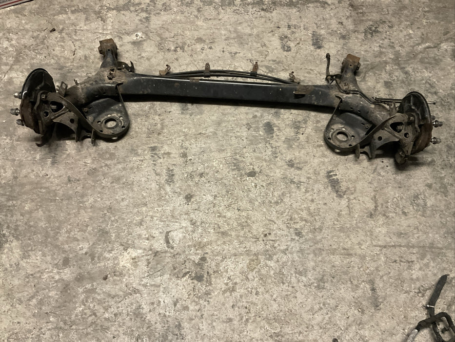 2014 TOYOTA PRIUS V REAR AXLE BEAM REAR SUSPENSION SUBFRAME ASSEMBLY OEM
