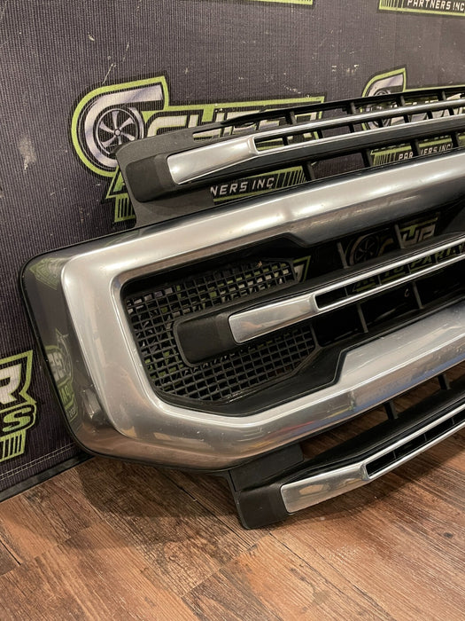 2020-22 FORD F250 PLATI FRONT BUMPER GRILLE OEM *READ/2 MISS CLIPS/NO EMBLEM*