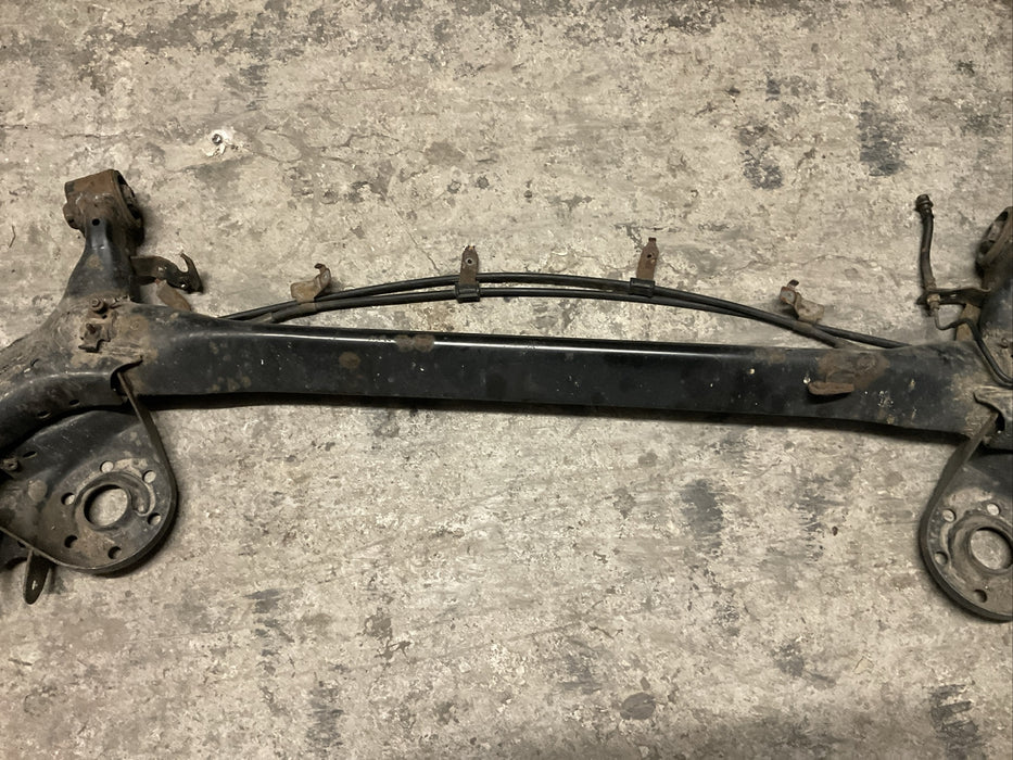 2014 TOYOTA PRIUS V REAR AXLE BEAM REAR SUSPENSION SUBFRAME ASSEMBLY OEM