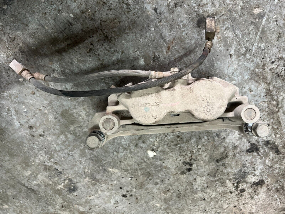 2016 2019 NISSAN TITAN XD FRONT DRIVER'S BRAKE CALIPER W/ BRAKE HOSE OEM