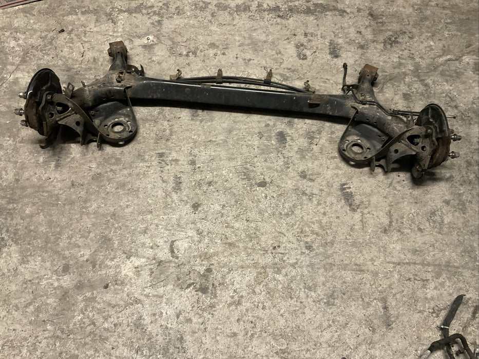 2014 TOYOTA PRIUS V REAR AXLE BEAM REAR SUSPENSION SUBFRAME ASSEMBLY OEM