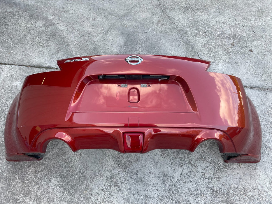 2009-2020 NISSAN 370Z REAR BUMPER COVER COMPLETE MAGMA RED OEM