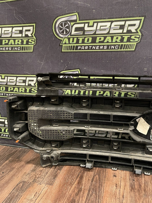 2020-22 FORD F250 PLATI FRONT BUMPER GRILLE OEM *READ/2 MISS CLIPS/NO EMBLEM*