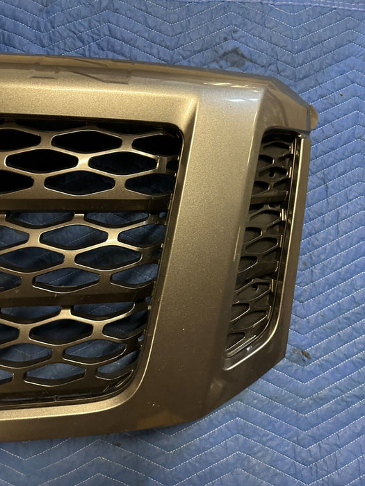 2016-2019 NISSAN TITAN XD PRO-4X GRILLE W/ CAMERA EMBLEM PAINTED GREY OEM