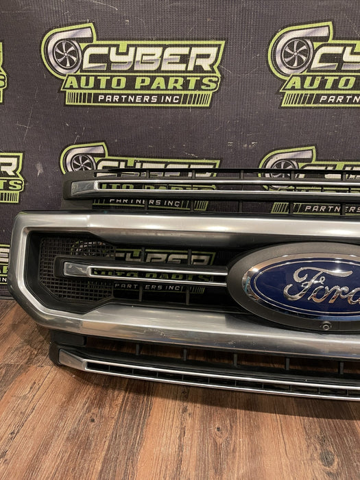 2020-22 FORD F250 PLATI FRONT BUMPER GRILLE OEM *READ/2 MISS CLIPS/NO EMBLEM*