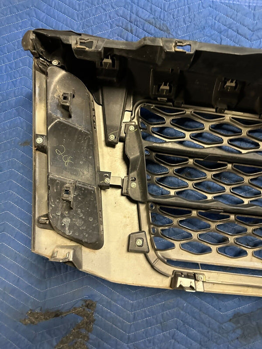 2016-2019 NISSAN TITAN XD PRO-4X GRILLE W/ CAMERA EMBLEM PAINTED GREY OEM