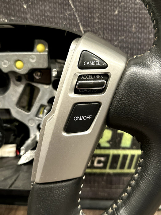 2016-19 NISSAN TITAN & XD LEATHER STEERING WHEEL W CRUISE OEM *READ/MINOR FLAWS*